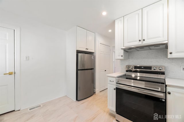 299 Riva Ave, East Brunswick, NJ 08850 - kitchen featuring stainless steel appliances, under cabinet range hood, white cabinets, decorative backsplash, and recessed lighting