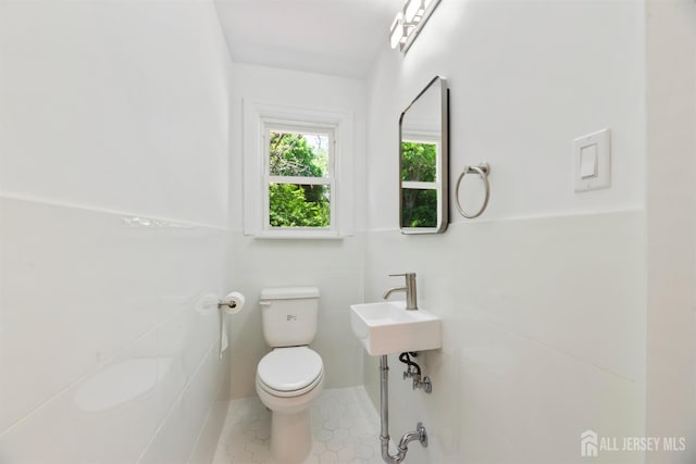 299 Riva Ave, East Brunswick, NJ 08850 - bathroom with tile patterned flooring and tile walls