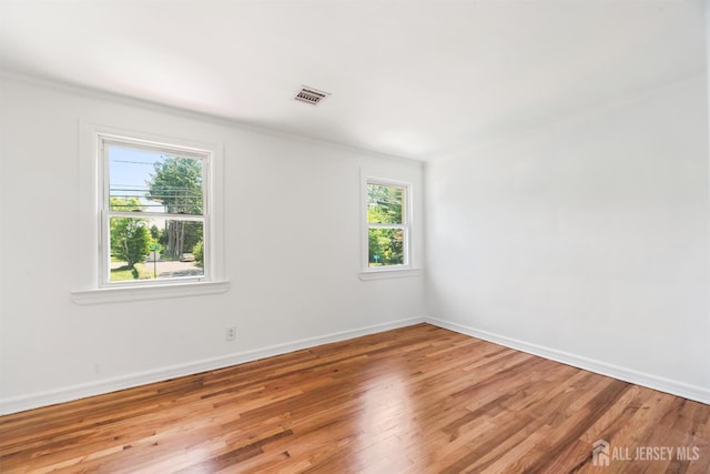 299 Riva Ave, East Brunswick, NJ 08850 - spare room featuring wood finished floors, baseboards, and crown molding