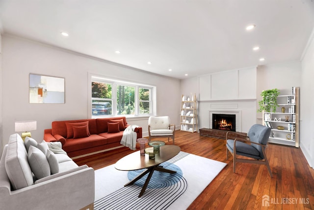 299 Riva Ave, East Brunswick, NJ 08850 - living area featuring dark wood finished floors, recessed lighting, a fireplace, and ornamental molding