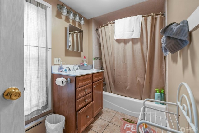 bathroom featuring tile patterned flooring, vanity, and shower / bathtub combination with curtain