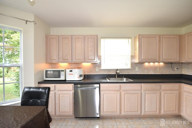 kitchen with light brown cabinets, sink, stainless steel dishwasher, tasteful backsplash, and light tile patterned flooring