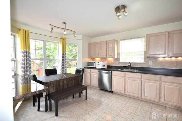 kitchen with decorative backsplash, light brown cabinetry, sink, dishwasher, and light tile patterned flooring