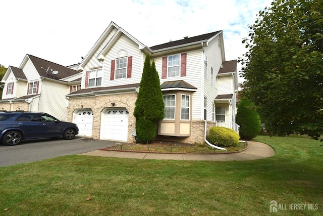 front facade featuring a garage and a front lawn