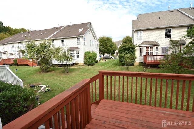 deck featuring a yard