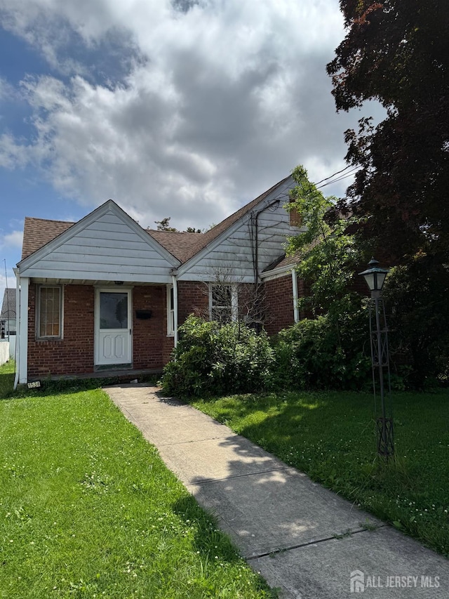 1534 Julian Ter, Union Twp, NJ 07083 - bungalow featuring a front yard and brick siding