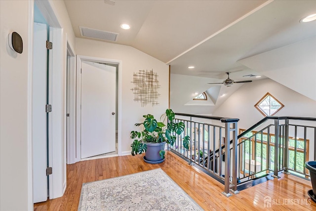 207 Dellwood Rd, Metuchen, NJ 08840 - corridor featuring vaulted ceiling, plenty of natural light, wood finished floors, recessed lighting, and an upstairs landing