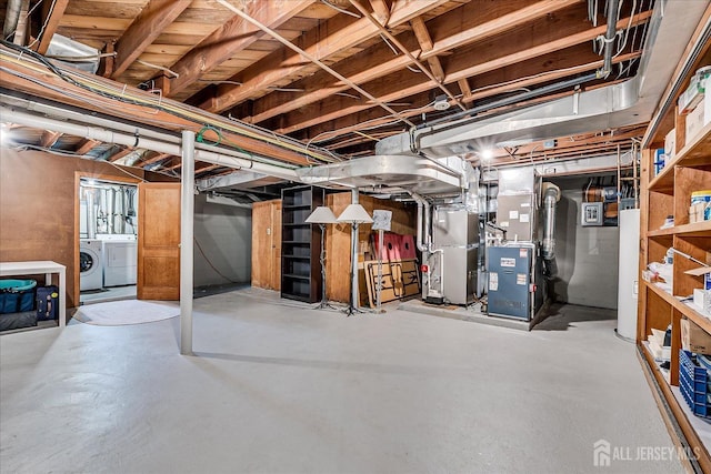 207 Dellwood Rd, Metuchen, NJ 08840 - unfinished below grade area featuring washing machine and clothes dryer