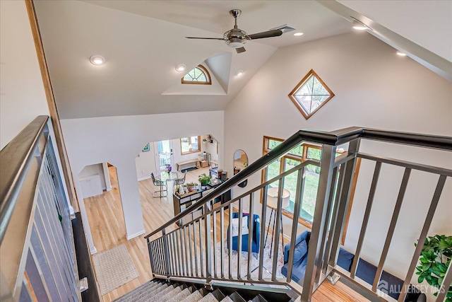 207 Dellwood Rd, Metuchen, NJ 08840 - stairs with ceiling fan, wood finished floors, arched walkways, recessed lighting, and high vaulted ceiling