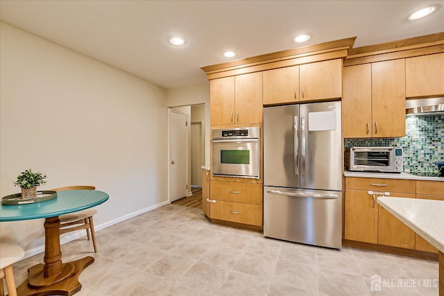 207 Dellwood Rd, Metuchen, NJ 08840 - kitchen featuring appliances with stainless steel finishes, wall chimney range hood, decorative backsplash, light countertops, and recessed lighting