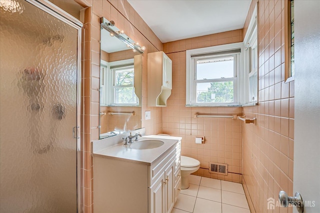 207 Dellwood Rd, Metuchen, NJ 08840 - bathroom featuring a shower stall, tile patterned flooring, tile walls, vanity, and toilet