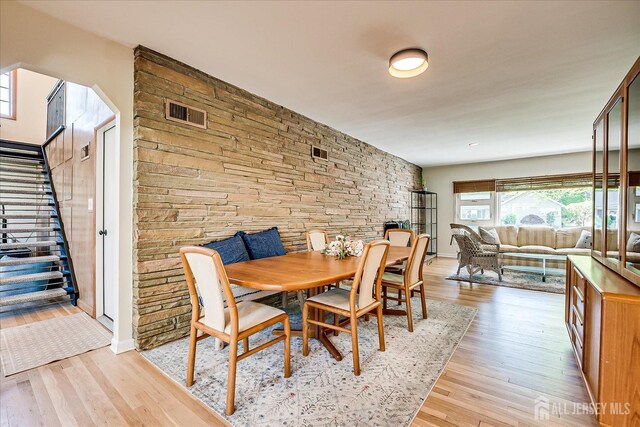 207 Dellwood Rd, Metuchen, NJ 08840 - dining space featuring stairs and light wood-type flooring