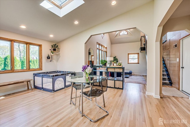 207 Dellwood Rd, Metuchen, NJ 08840 - dining space featuring light wood-style floors, vaulted ceiling, arched walkways, baseboards, and recessed lighting
