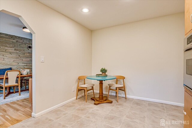 207 Dellwood Rd, Metuchen, NJ 08840 - dining space with baseboards, arched walkways, and recessed lighting