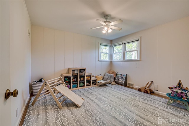 207 Dellwood Rd, Metuchen, NJ 08840 - rec room with a ceiling fan and a decorative wall