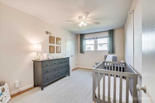 207 Dellwood Rd, Metuchen, NJ 08840 - bedroom featuring baseboards, a nursery area, and ceiling fan