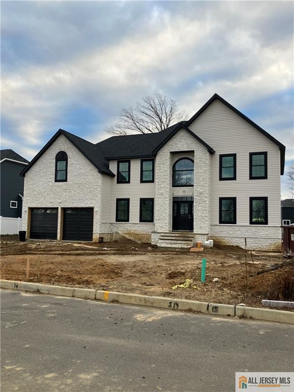 4 Kristina Ct, East Brunswick, NJ 08816 - view of front facade featuring a garage