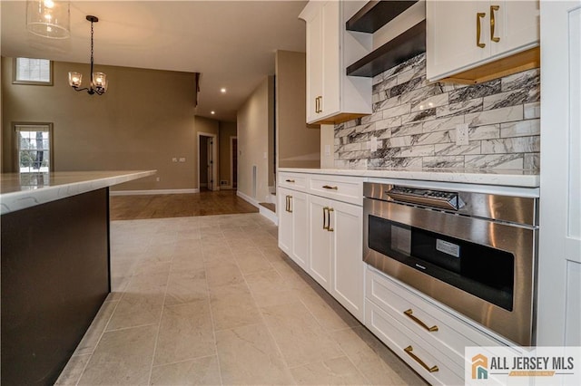 4 Kristina Ct, East Brunswick, NJ 08816 - kitchen featuring decorative backsplash, white cabinets, oven, recessed lighting, and hanging light fixtures