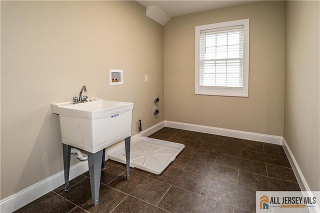4 Kristina Ct, East Brunswick, NJ 08816 - washroom featuring washer hookup, baseboards, and dark tile patterned floors