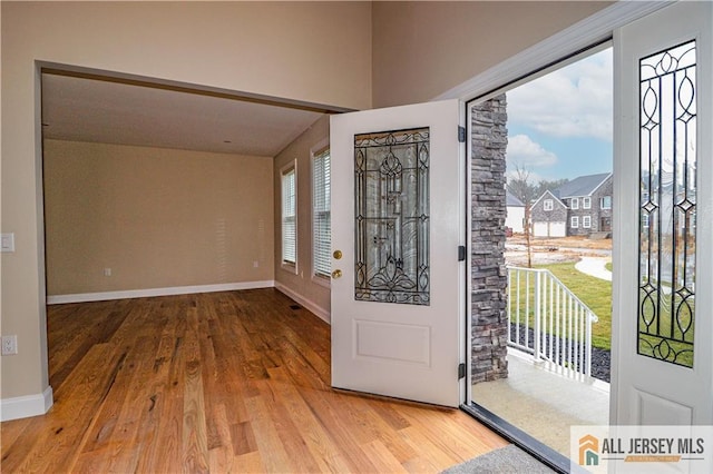 4 Kristina Ct, East Brunswick, NJ 08816 - entryway featuring wood finished floors, plenty of natural light, and baseboards