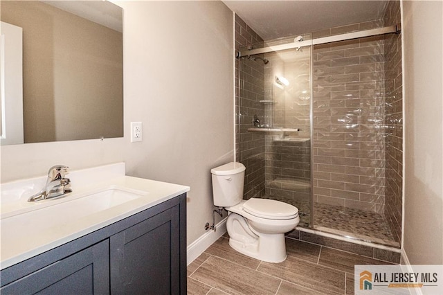 4 Kristina Ct, East Brunswick, NJ 08816 - bathroom featuring toilet, a stall shower, vanity, and baseboards