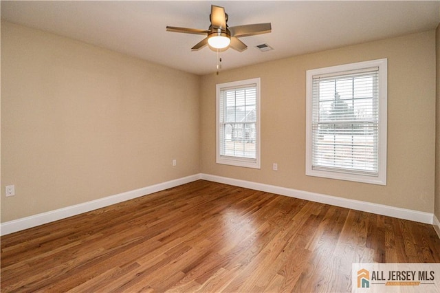 4 Kristina Ct, East Brunswick, NJ 08816 - unfurnished room with healthy amount of natural light, baseboards, and wood finished floors