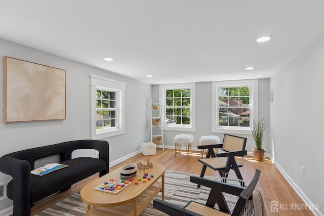 831 W Inman Ave, Rahway, NJ 07065 - living area featuring light wood-style flooring, healthy amount of natural light, baseboards, and recessed lighting