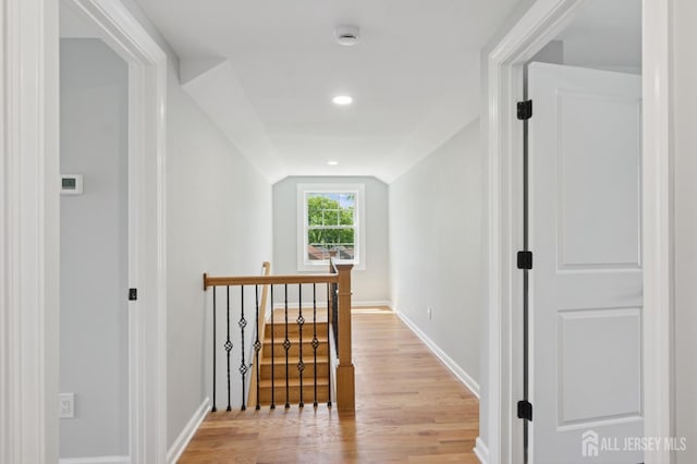 831 W Inman Ave, Rahway, NJ 07065 - hall with vaulted ceiling, light wood-style floors, baseboards, an upstairs landing, and recessed lighting