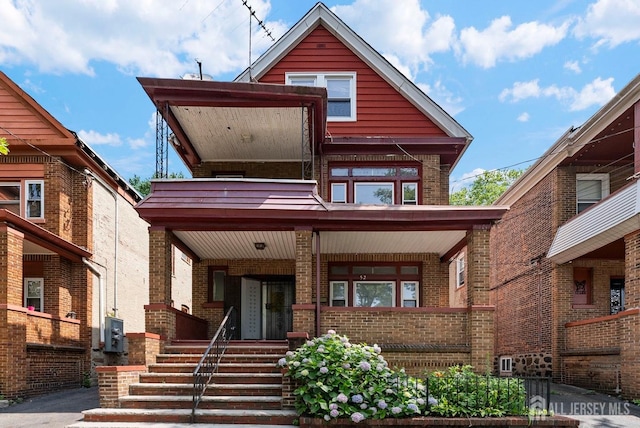52 Wade St, Jersey City, NJ 07305 - view of front of home with a porch and brick siding