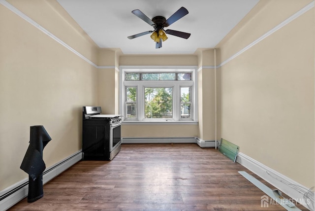 52 Wade St, Jersey City, NJ 07305 - empty room featuring baseboard heating, wood finished floors, and ceiling fan