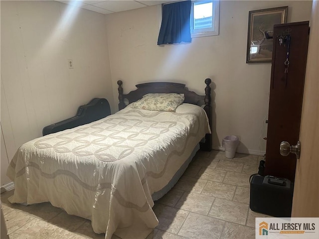 56 Harvey Cir E, Brunswick, NJ 08816 - bedroom featuring light stone finish flooring and baseboards