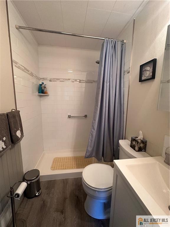 56 Harvey Cir E, Brunswick, NJ 08816 - bathroom with wood finished floors, a shower stall, and vanity