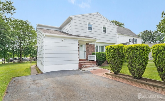 2001 Grant Ave, South Plainfield, NJ 07080 - view of front facade with a front lawn