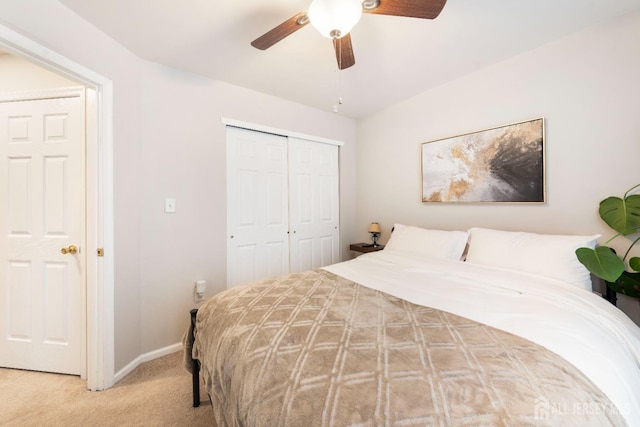 bedroom featuring carpet, a closet, ceiling fan, and baseboards