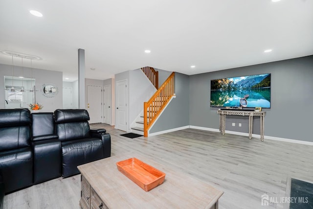324 Oak Knoll Dr, Manalapan, NJ 07726 - living room featuring light wood-style floors, stairs, and recessed lighting