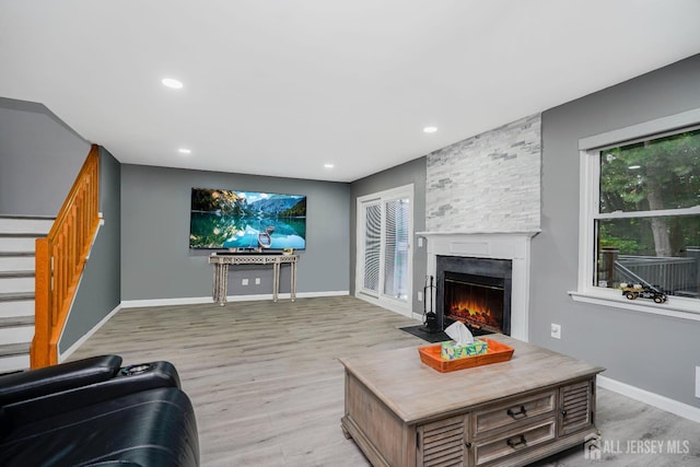 324 Oak Knoll Dr, Manalapan, NJ 07726 - living area with stairs, a fireplace, light wood finished floors, and recessed lighting