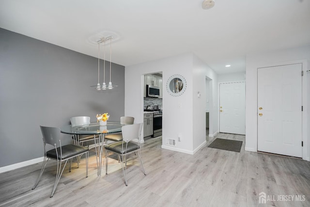 324 Oak Knoll Dr, Manalapan, NJ 07726 - dining space with light wood-type flooring and recessed lighting