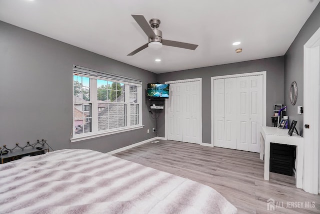 324 Oak Knoll Dr, Manalapan, NJ 07726 - unfurnished bedroom featuring two closets, wood finished floors, recessed lighting, and a ceiling fan