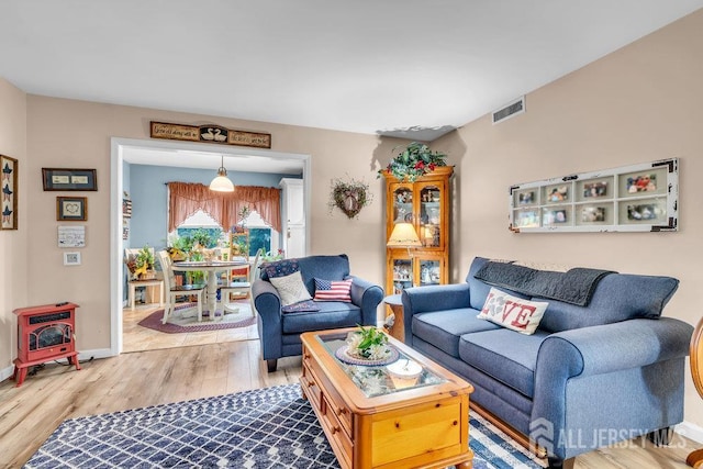 living room featuring wood finished floors and baseboards
