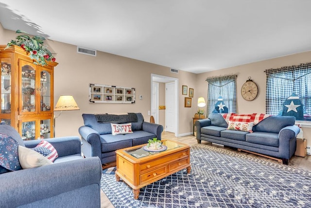 living room with wood finished floors and baseboards