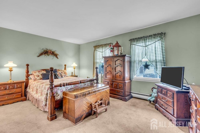 bedroom featuring baseboard heating and light colored carpet