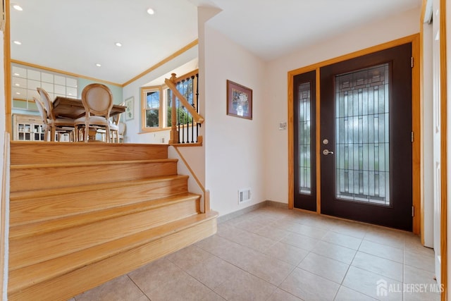 foyer featuring tile patterned flooring, stairway, baseboards, and recessed lighting