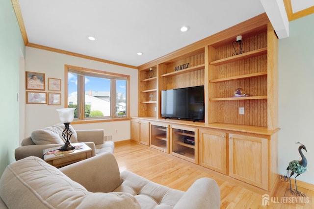 living area with ornamental molding, light wood-type flooring, recessed lighting, baseboards, and built in features