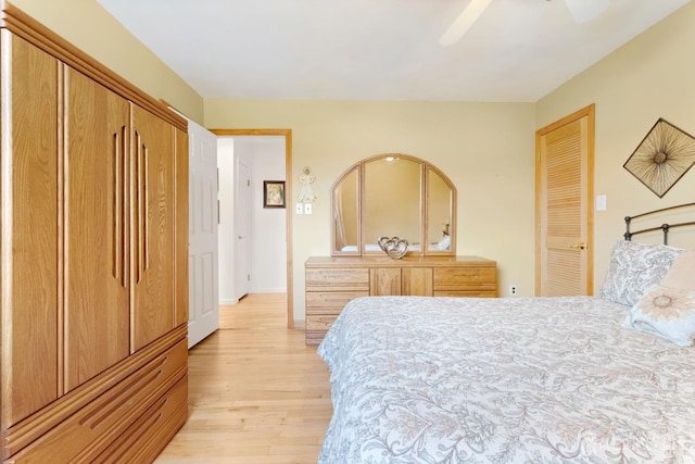 bedroom featuring light wood-type flooring and a ceiling fan
