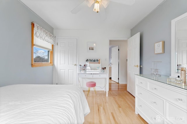 bedroom featuring light wood-style floors and ceiling fan