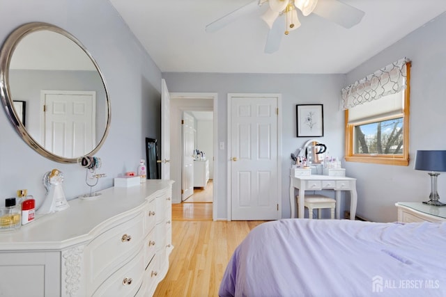 bedroom with light wood-type flooring and ceiling fan