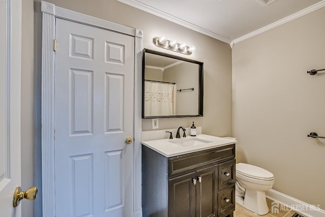 bathroom featuring ornamental molding, toilet, and vanity