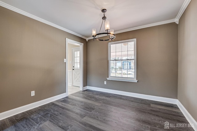 unfurnished dining area featuring ornamental molding, dark hardwood / wood-style floors, and a notable chandelier