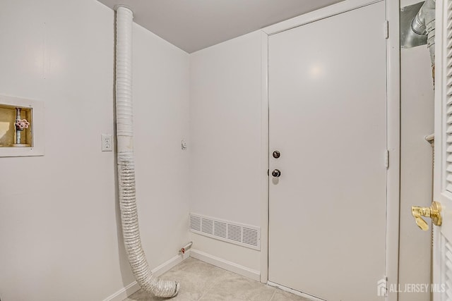 clothes washing area featuring electric dryer hookup