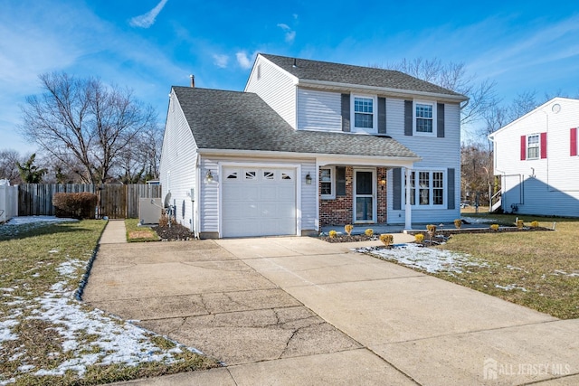 front of property featuring a garage, covered porch, and a front yard